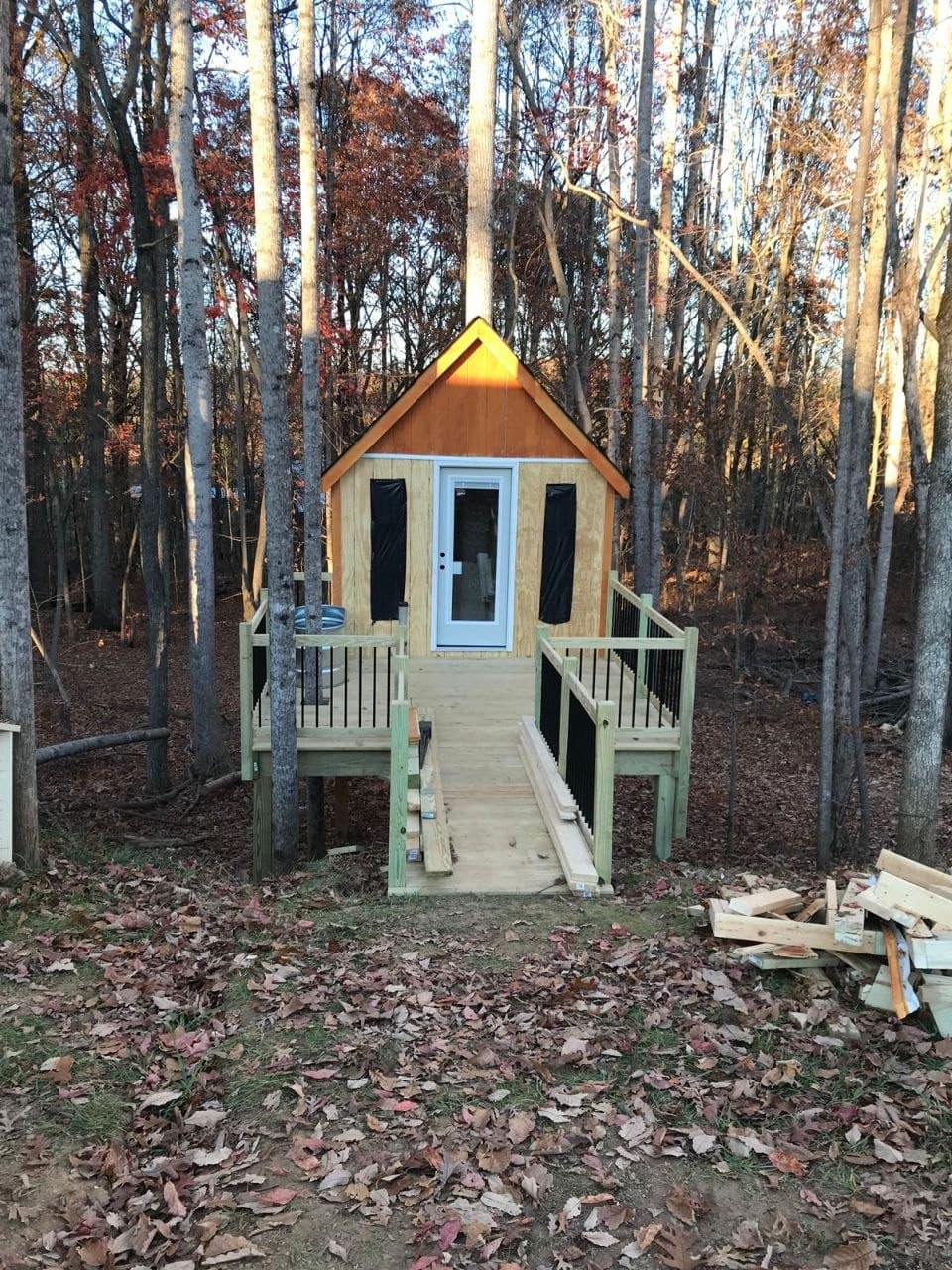 Kids playhouse with deck and ramp